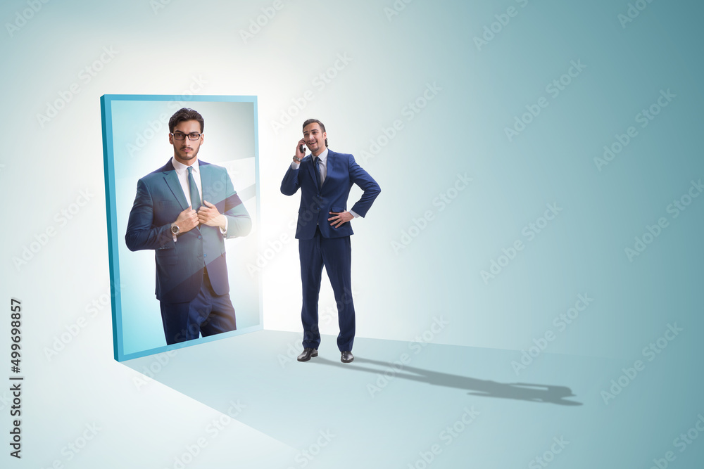 Young businessman in alter ego concept Young businessman in alter ego concept