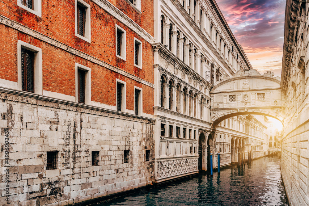 View of the canals with the Bridge of Sighs at sunset in Venice, Italy - travel concept.