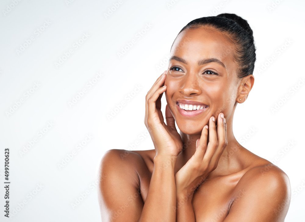 Her skin speaks for itself. Studio shot of an attractive young woman posing and gently touching her face while standing against a white background. Her skin speaks for itself. Studio shot of an attractive young woman posing and gently touching her face while standing against a white background.