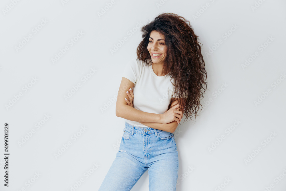 GREAT OFFER. Happy overjoyed pretty Latin female with afro folded arms, crossing hand, smiling, laughing, looking aside, stay isolated over white background. Copy space, free place, fashion banner GREAT OFFER. Happy overjoyed pretty Latin female with afro folded arms, crossing hand, smiling, laughing, looking aside, stay isolated over white background. Copy space, free place, fashion banner
