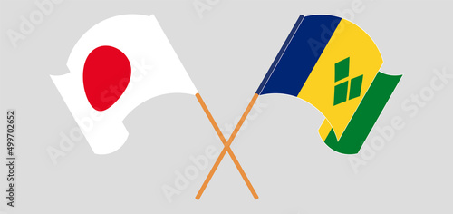 Crossed and waving flags of Japan and Saint Vincent and the Grenadines