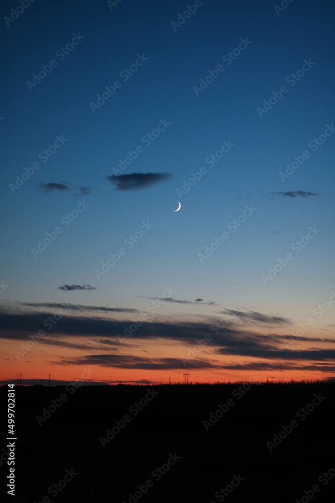 Fototapeta premium sunset by the moon crescent 