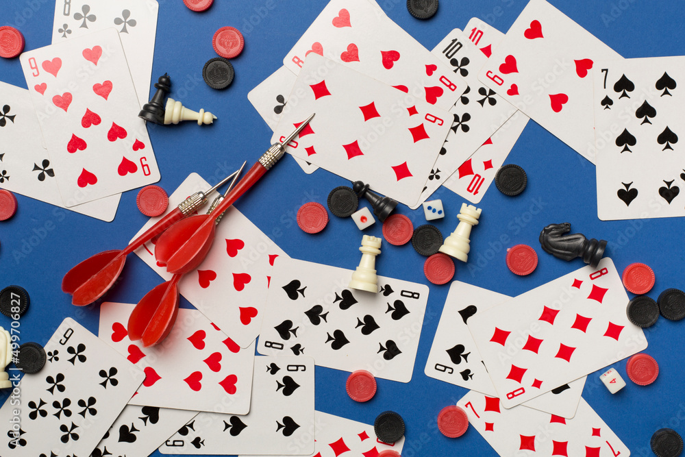 Different board games on color background, top view Different board games on color background, top view