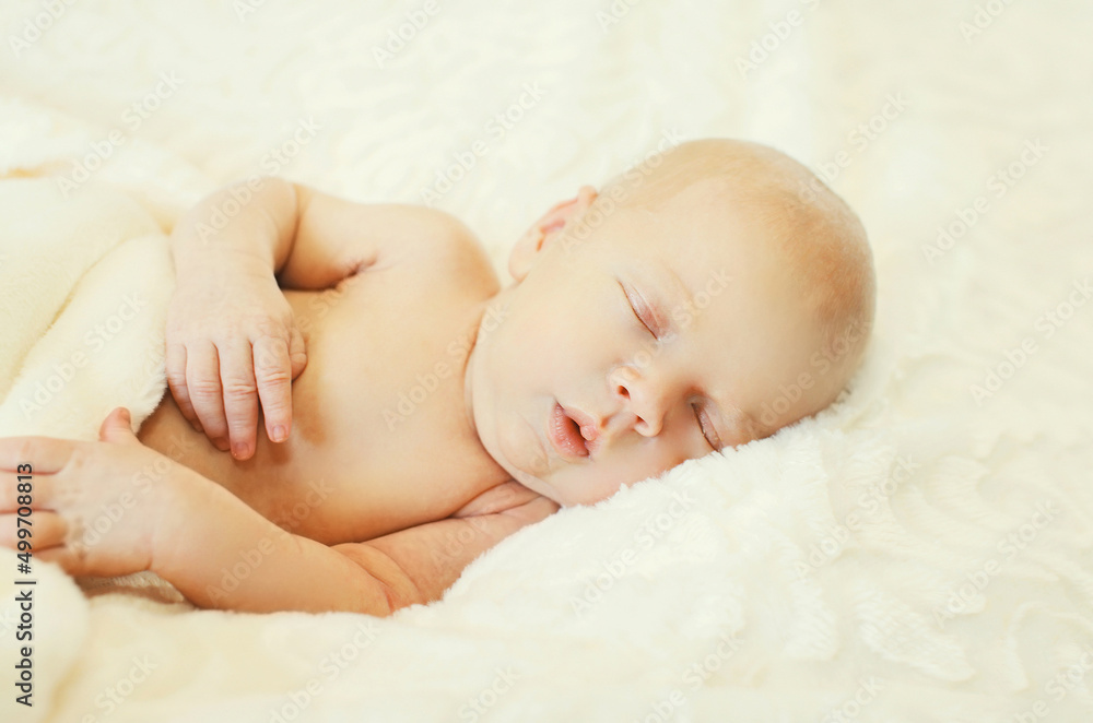 Close up portrait of infant sweet sleeping on white bed at home Close up portrait of infant sweet sleeping on white bed at home
