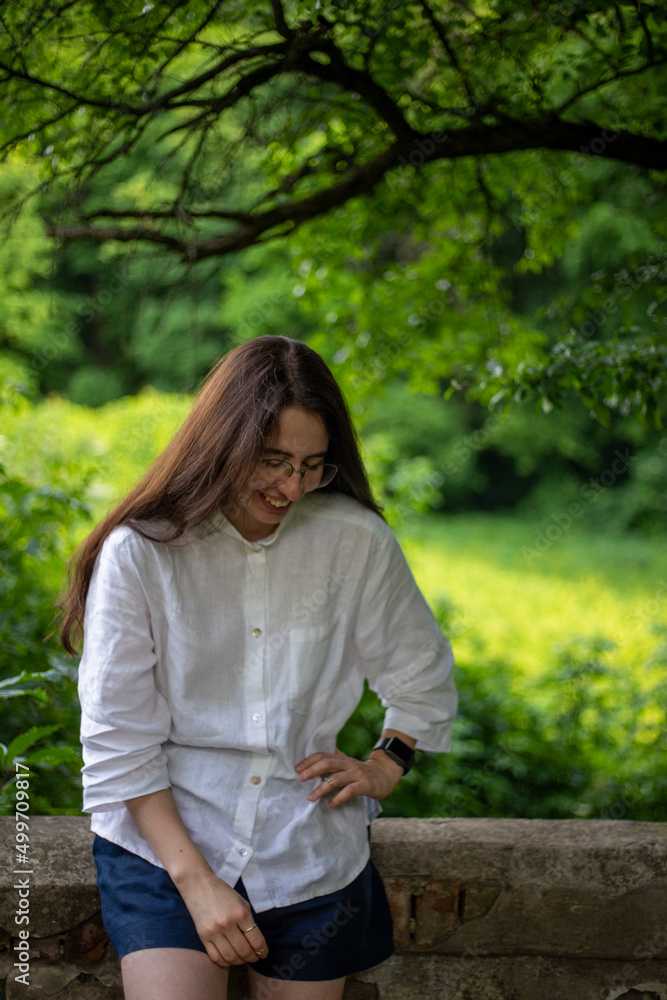 Beautiful young woman outdoor lifestyle portrait. Selective focus. Beautiful young woman outdoor lifestyle portrait. Selective focus.