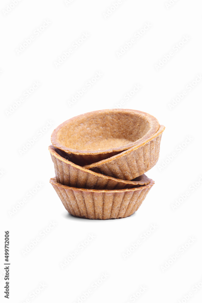 Stack of empty tartlets (tarts, tart shells) isolated on the white background Stack of empty tartlets (tarts, tart shells) isolated on the white background