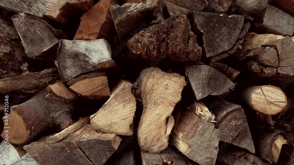 Firewood stacked in a pile for winter heating in the stove
Firewood stacked in a pile for winter heating in the stove
