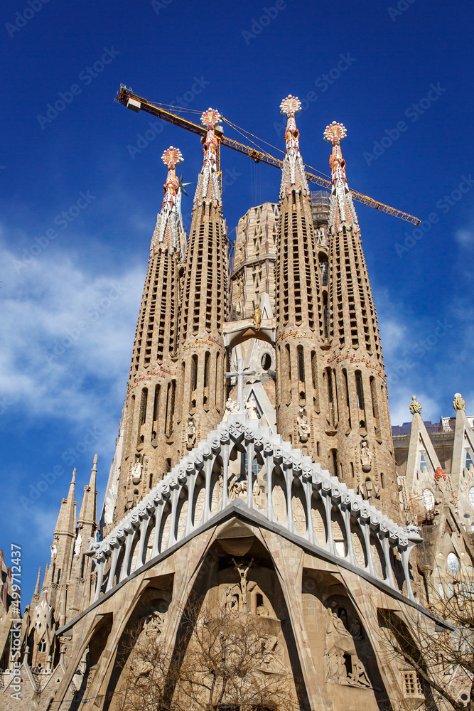 Sagrada Familia in Barcelona, Spain against blue sky.