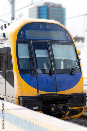 Commuter train approaching at a train station in Sydney NSW Australia blurred background 