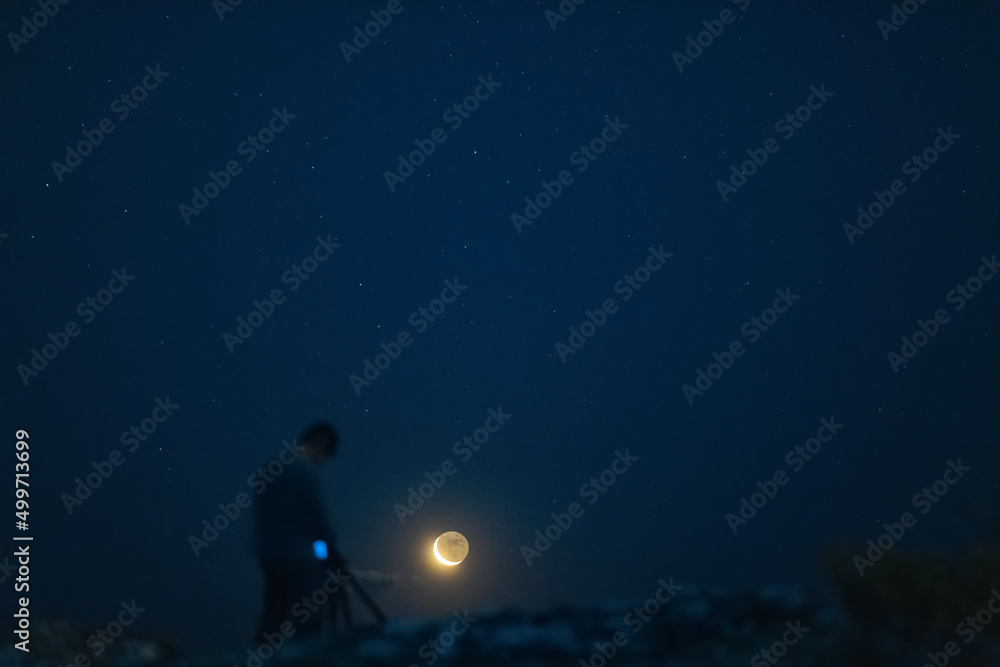photographer watching the moon photographer watching the moon