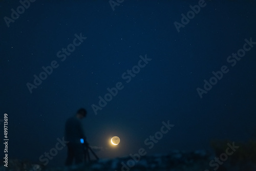 photographer watching the moon