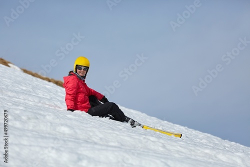 Skier resting on the slope