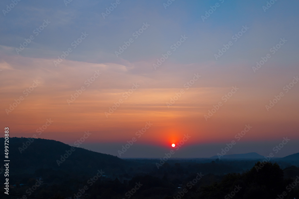 Beautiful sunset sky on the mountains. Countryside landscape under scenic sky at sunset background.