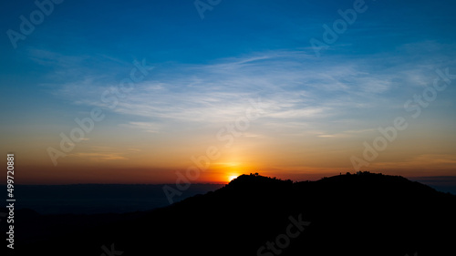 Beautiful sunrise landscape on the mountain of thailand. Golden and blue sky sunrise in the morning.