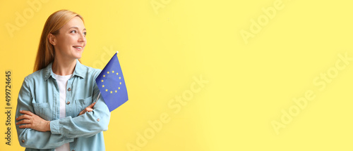 Mature woman holding flag o...