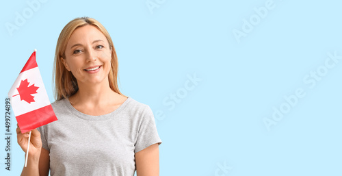 Mature woman holding Canadi...