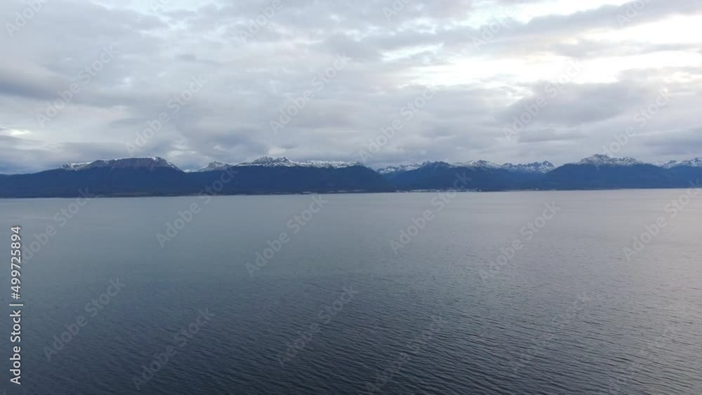 Seascape. Aerial view of the ocean and mountains at nightfall. Seascape. Aerial view of the ocean and mountains at nightfall.