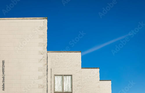 Abstract architecture against blue sky. Modern white building against a blue sky