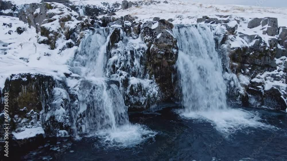 Drone Arcing Round Waterfalls And Frozen Landscape Drone Arcing Round Waterfalls And Frozen Landscape