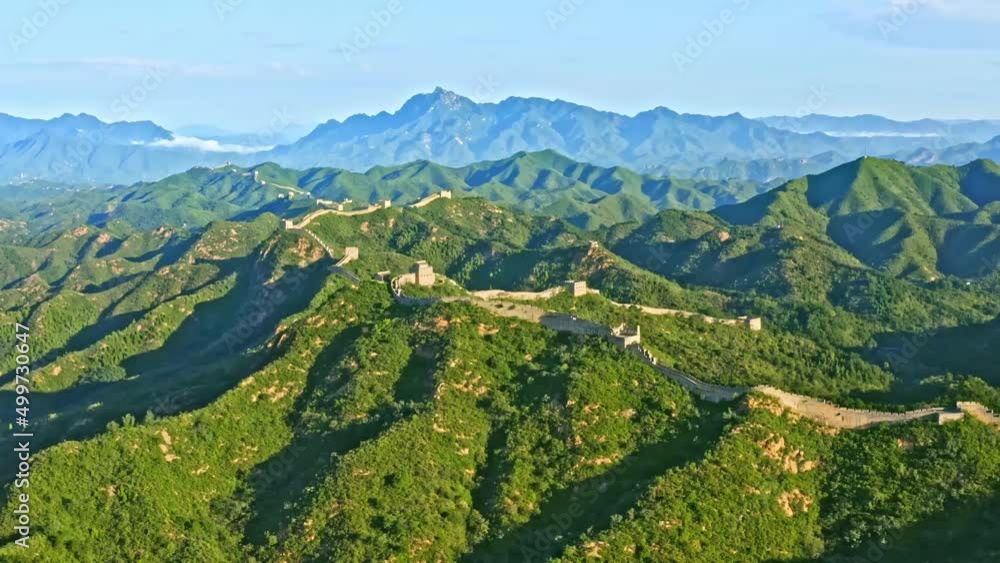 Rotating aerial view of the Great Wall of China and surrounding green mountains Rotating aerial view of the Great Wall of China and surrounding green mountains