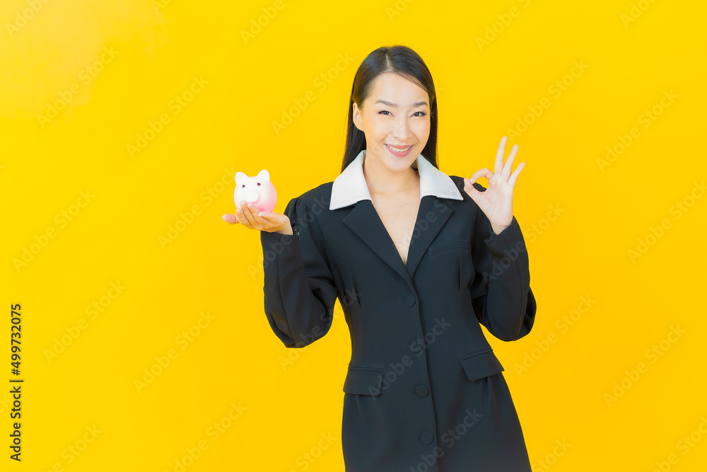 Portrait beautiful young asian woman with piggy bank Portrait beautiful young asian woman with piggy bank