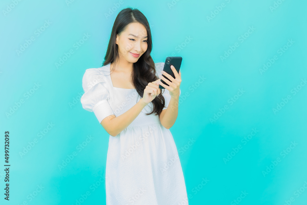 Portrait beautiful young asian woman smile with smart mobile phone Portrait beautiful young asian woman smile with smart mobile phone
