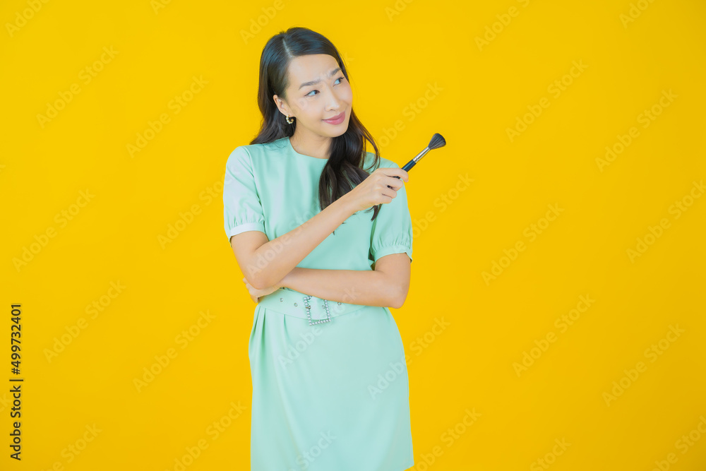 Portrait beautiful young asian woman with make up brush cosmetic Portrait beautiful young asian woman with make up brush cosmetic