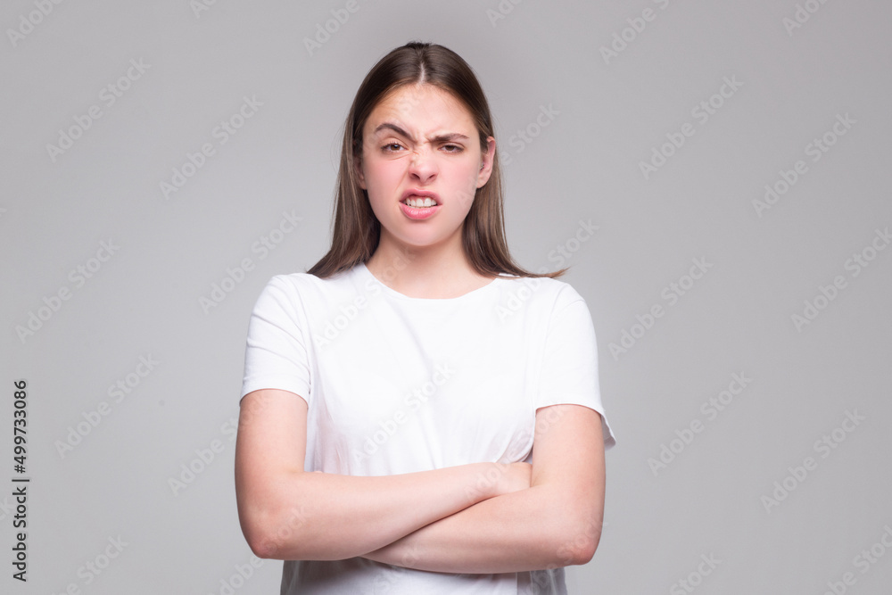 Fototapeta premium Emotional angry woman, upset girl. Screaming, hate, rage. Pensive woman feeling furious mad and crazy stress.