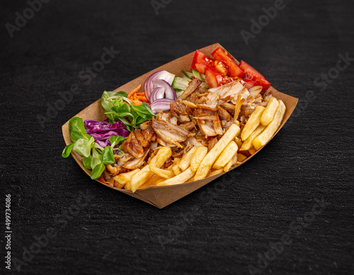 Doner kebab on a paper plate