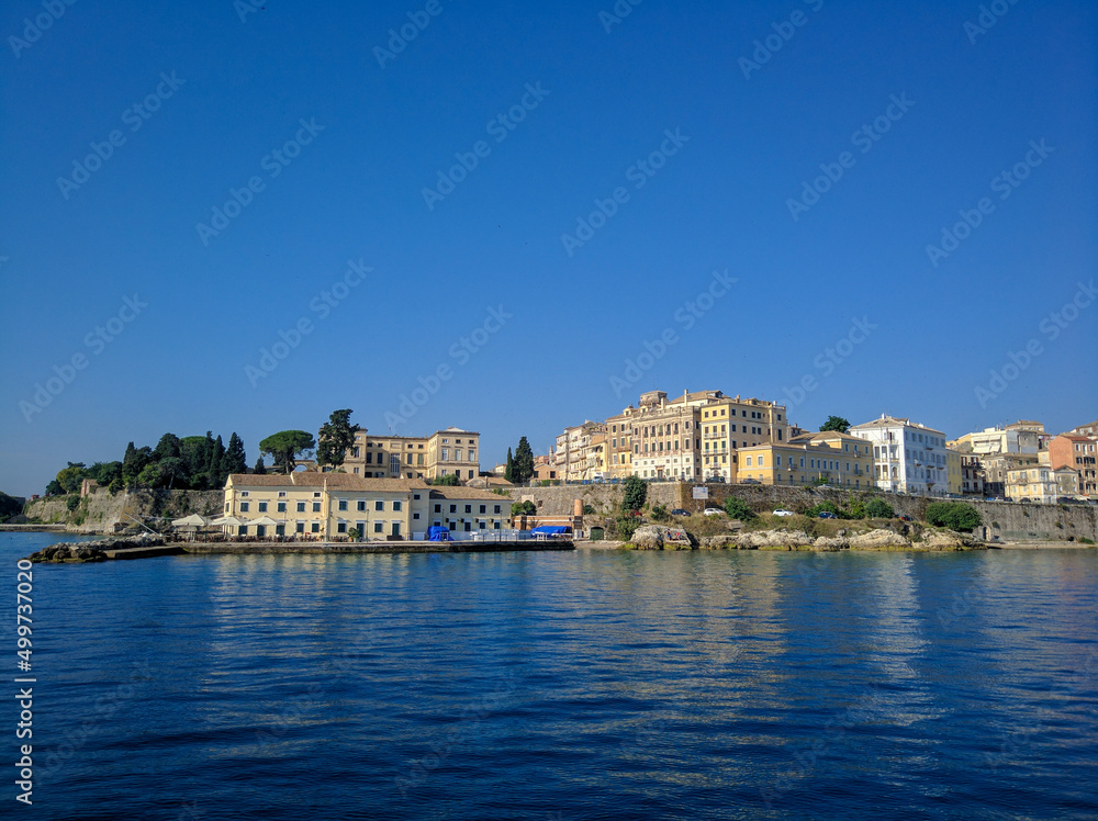 Corfu, Greece - July 7, 2018: Beautiful view from the ship to the old town of Corfu against the blue sky. Copy space