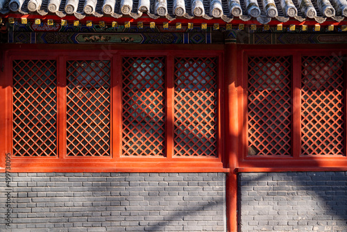 Obraz na płótnie Red wooden window with decoration colorful painting beam and wood pole from ancient china palace in forbidden City, Beijing, China w salonie