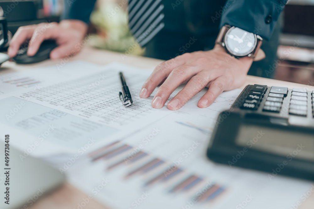 Fototapeta premium A pen on company data, document and report on desk office while accounting working. Accounting business concept.