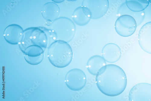Soap Bubbles Floating on Blue Background. Soap Sud Bubbles Water.
