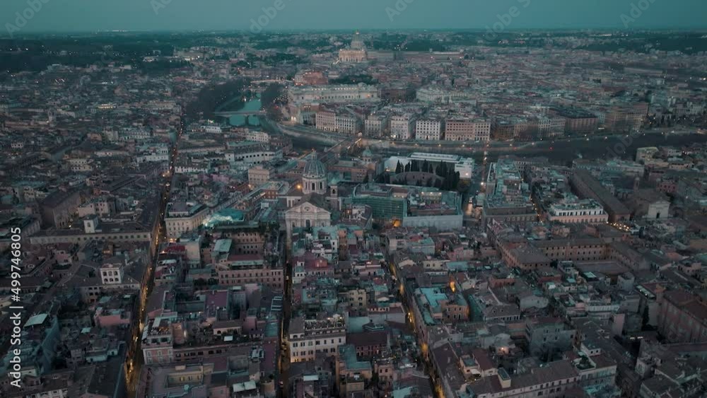 Aerial view overlooking the illuminated cityscape Rome, Italy - tilt, drone shot Aerial view overlooking the illuminated cityscape Rome, Italy - tilt, drone shot