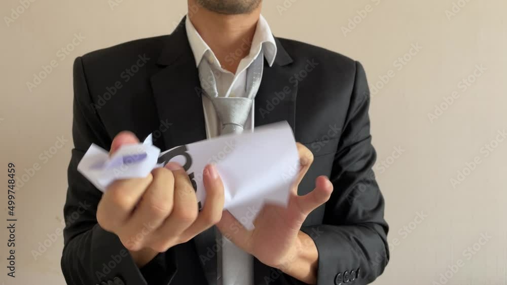 Frustrated asian male businessman professional crumpling paper with written message “addiction” word. Man in suit and tie having nervous breakdown furiously throwing crumpled paper at work in office Frustrated asian male businessman professional crumpling paper with written message “addiction” word. Man in suit and tie having nervous breakdown furiously throwing crumpled paper at work in office