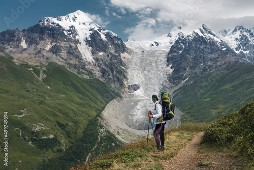 Young active girls hiking in Greater Caucasus mountains, Svaneti region, Mestia district, Svaneti, Georgia
