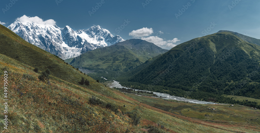 View of Svaneti Region and cayon, Caucasus Mountains, Georgia. Autumn landscape. Red colours.