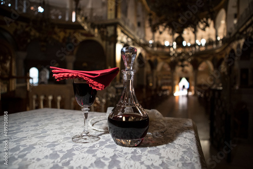 Wine carafe and glass in Greek orthodox church in Greece