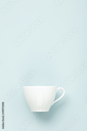 Blank White cup on blue background, flat lay, mock up, copy space