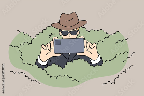 Private detective in sunglasses hiding in bushes photographing using smartphone camera. Spy or secret agent making photo with cellphone solving or detecting crime. Vector illustrations.