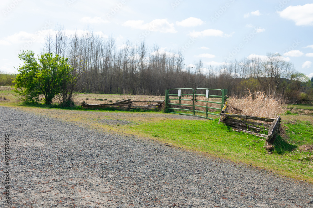 Gates and fence in the Billy Frank Jr. Nisqually National Wildlife Refuge area, WA, USA Gates and fence in the Billy Frank Jr. Nisqually National Wildlife Refuge area, WA, USA