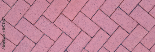 Wallpaper Mural Paving slabs laid out in shape of herringbone on city street background Torontodigital.ca