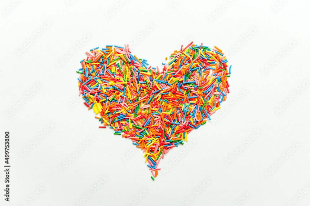 Simple concept flat lay with a heart made of sugar sprinkles. Simple concept flat lay with a heart made of sugar sprinkles.