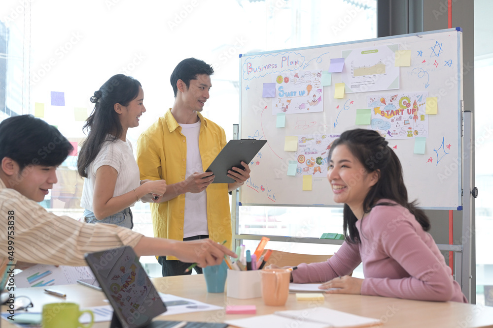 Group of creative people brainstorm over business project together. Group of creative people brainstorm over business project together.