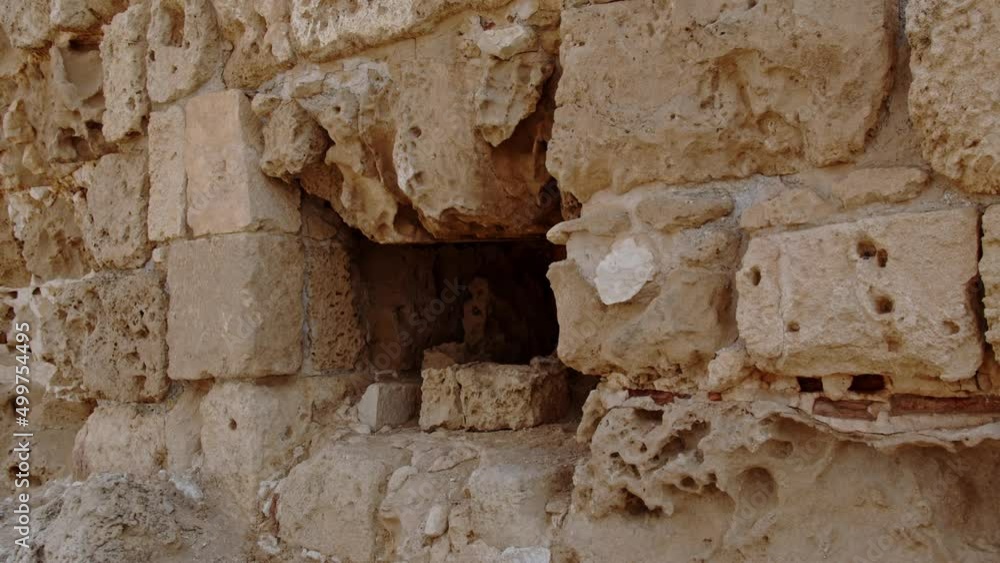 Empty space in ancient limestone wall in city of Salamis, motion view Empty space in ancient limestone wall in city of Salamis, motion view
