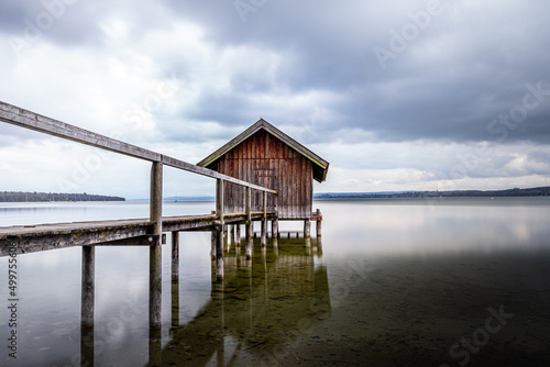 Traditional boathouse at lake Ammersee near Munich  Bavaria  Germany at sunrise.