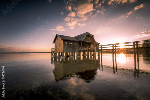 Print op canvas Traditional boathouse at lake Ammersee near Munich, Bavaria, Germany at sunrise