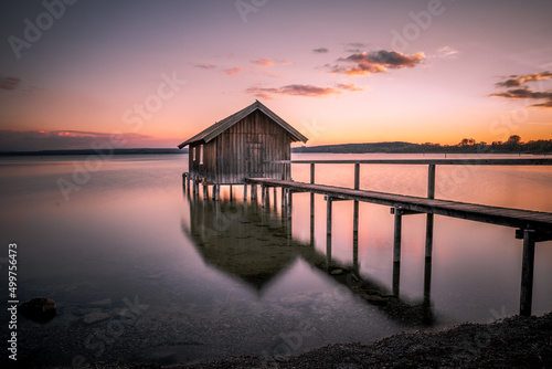 Fotografiet Traditional boathouse at lake Ammersee near Munich, Bavaria, Germany at sunrise
