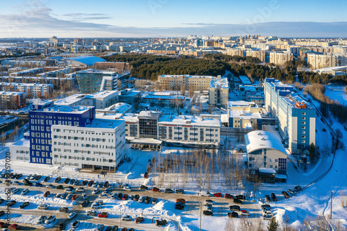 Surgut city in winter. Buildings of the district Clinical Hospital. Aerial view.