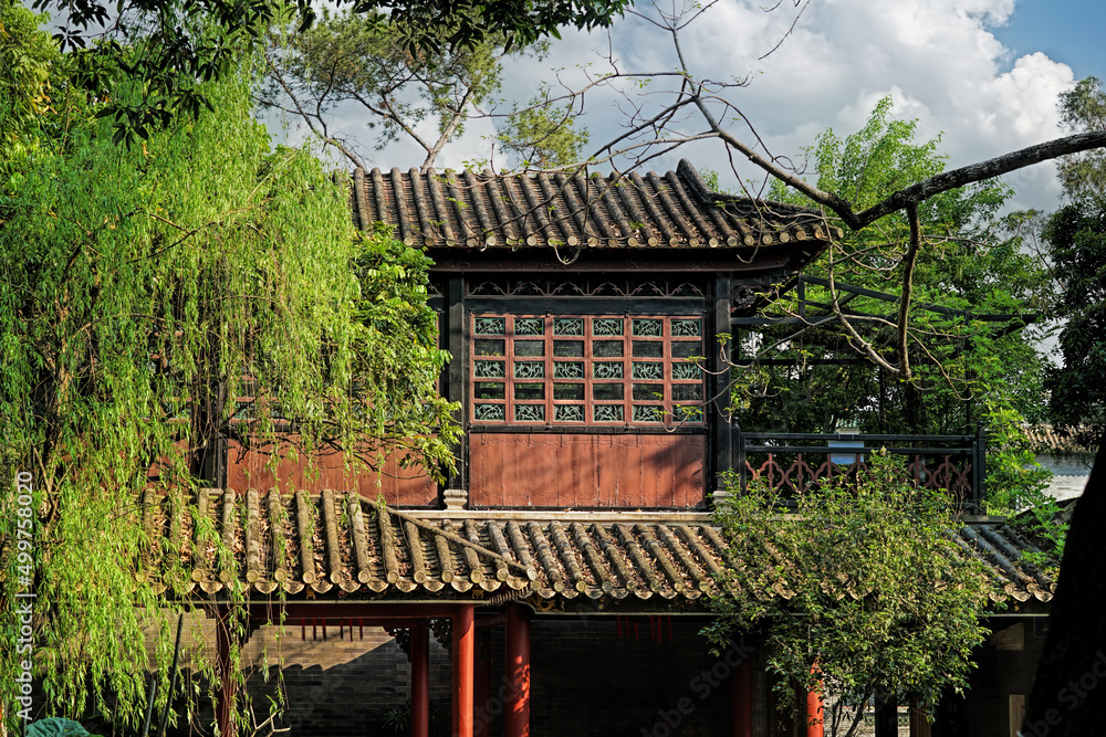 Foshan city, Guangdong, China. Shunde Qinghui Garden is one of the top ten famous gardens in China, Lingnan traditional style feature. Gazebo in traditional style. Foshan city, Guangdong, China. Shunde Qinghui Garden is one of the top ten famous gardens in China, Lingnan traditional style feature. Gazebo in traditional style.